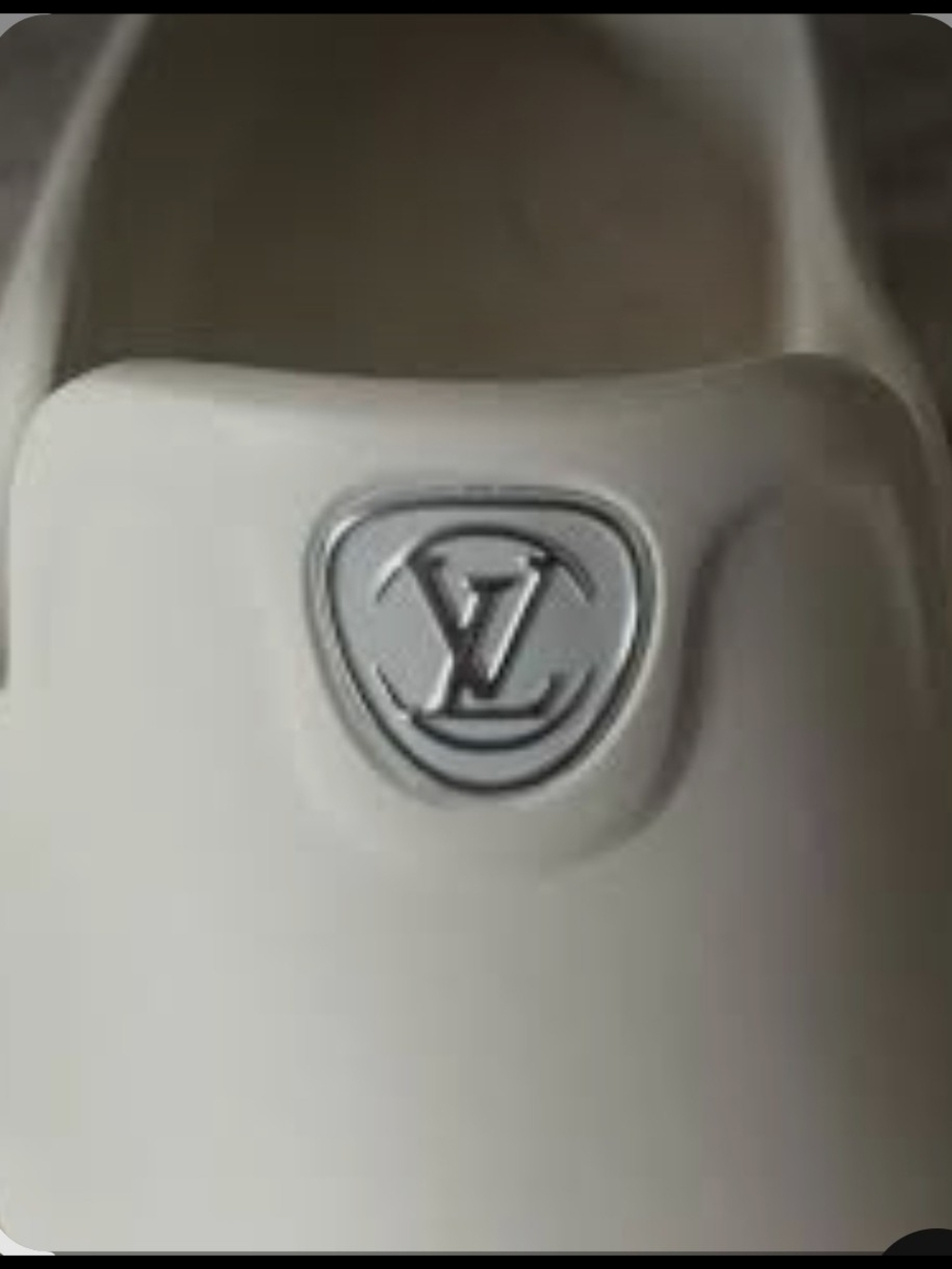 Louis Vuitton Cream Slide with Silver LV Emblem